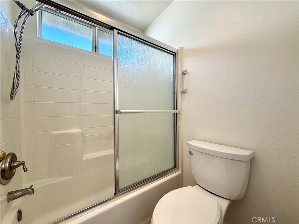 44836 Marge Place Temecula, CA 92592 - Photo 18 of 35 a white toilet sitting next to a bath tub