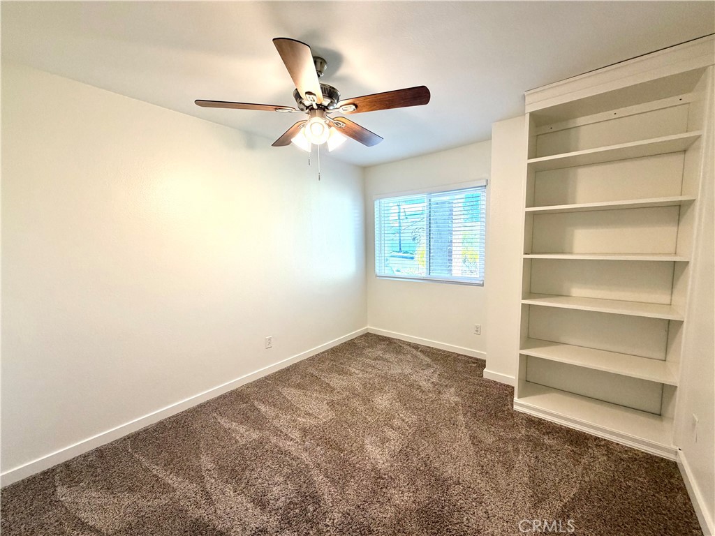 44836 Marge Place Temecula, CA 92592 - Photo 20 of 35 a view of a room with a ceiling fan and wooden floor