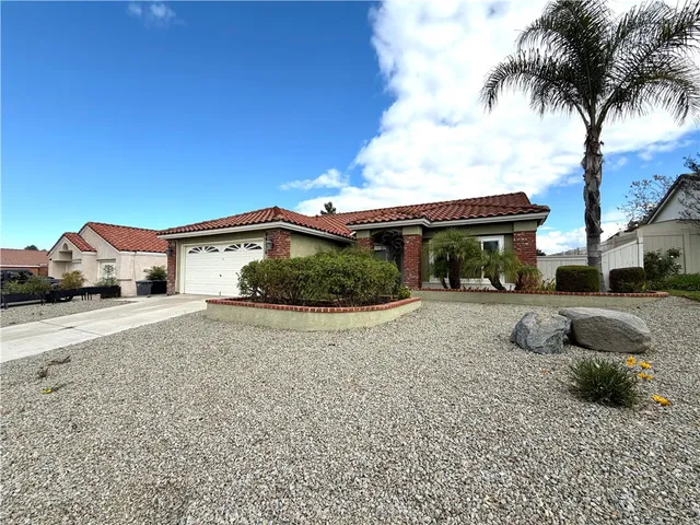 a house with palm tree in front of it