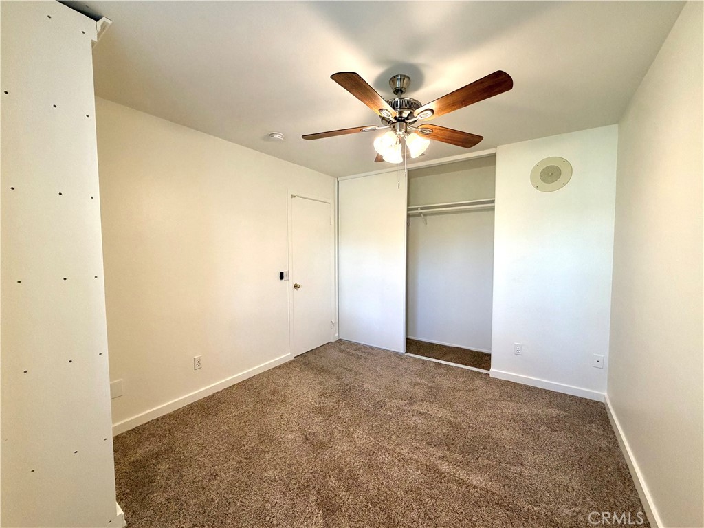 44836 Marge Place Temecula, CA 92592 - Photo 21 of 35 an empty room with a ceiling fan and a window