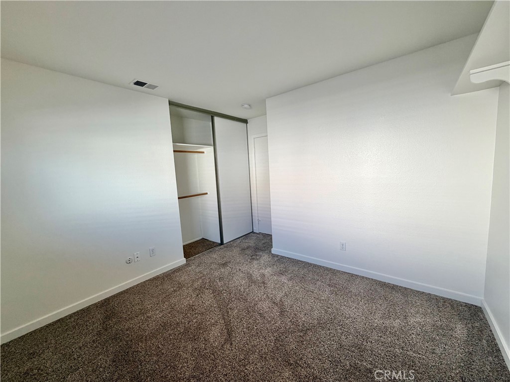 44836 Marge Place Temecula, CA 92592 - Photo 22 of 35 an empty room with closet and wooden floor