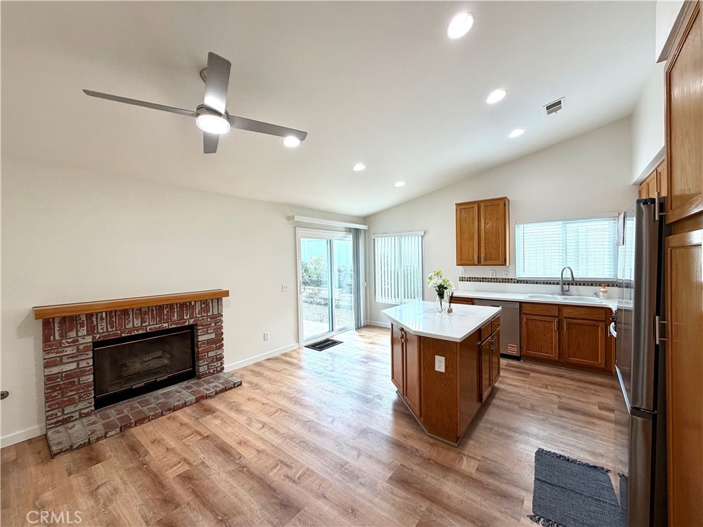44836 Marge Place Temecula, CA 92592 - Photo 9 of 35 a living room with furniture a fireplace and a window