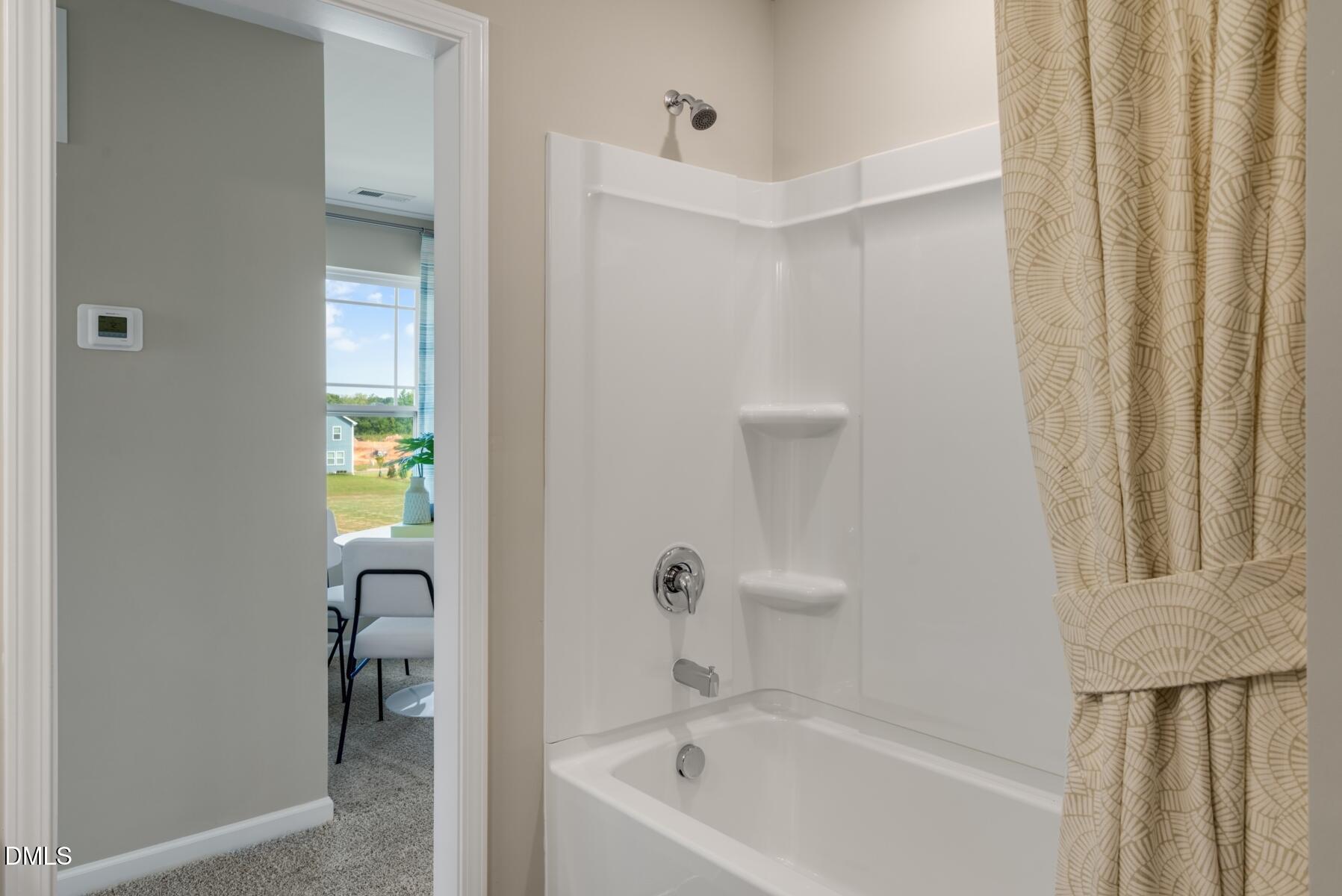 167 Siebold Street Garner, NC 27529 - Photo 11 of 46 a bathroom with a tub and shower