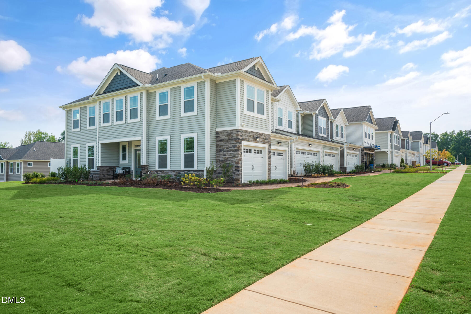 167 Siebold Street Garner, NC 27529 - Photo 12 of 42 a view of a big house with a big yard and large trees