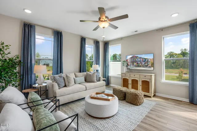 a living room with furniture and a fireplace