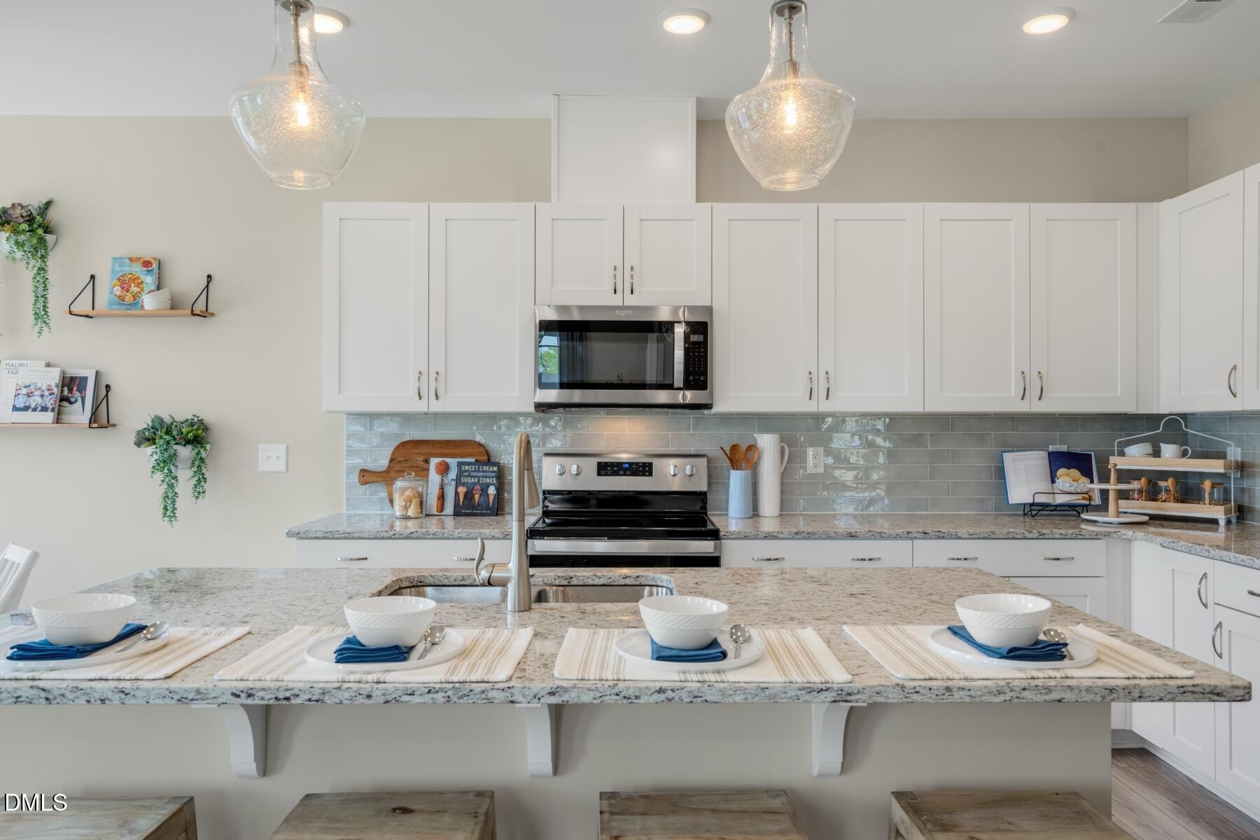 167 Siebold Street Garner, NC 27529 - Photo 28 of 42 a kitchen with a sink and cabinets