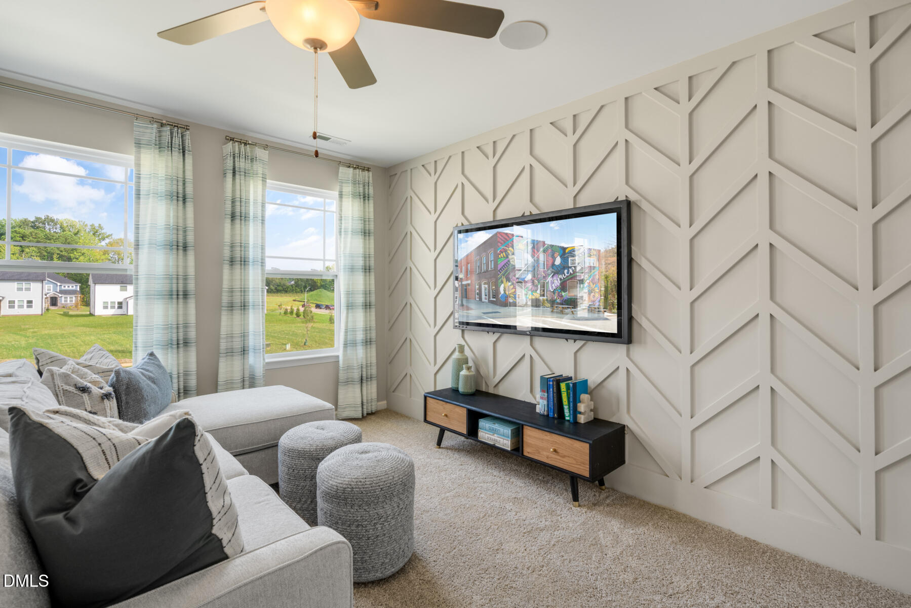 167 Siebold Street Garner, NC 27529 - Photo 35 of 46 a living room with furniture and a flat screen tv