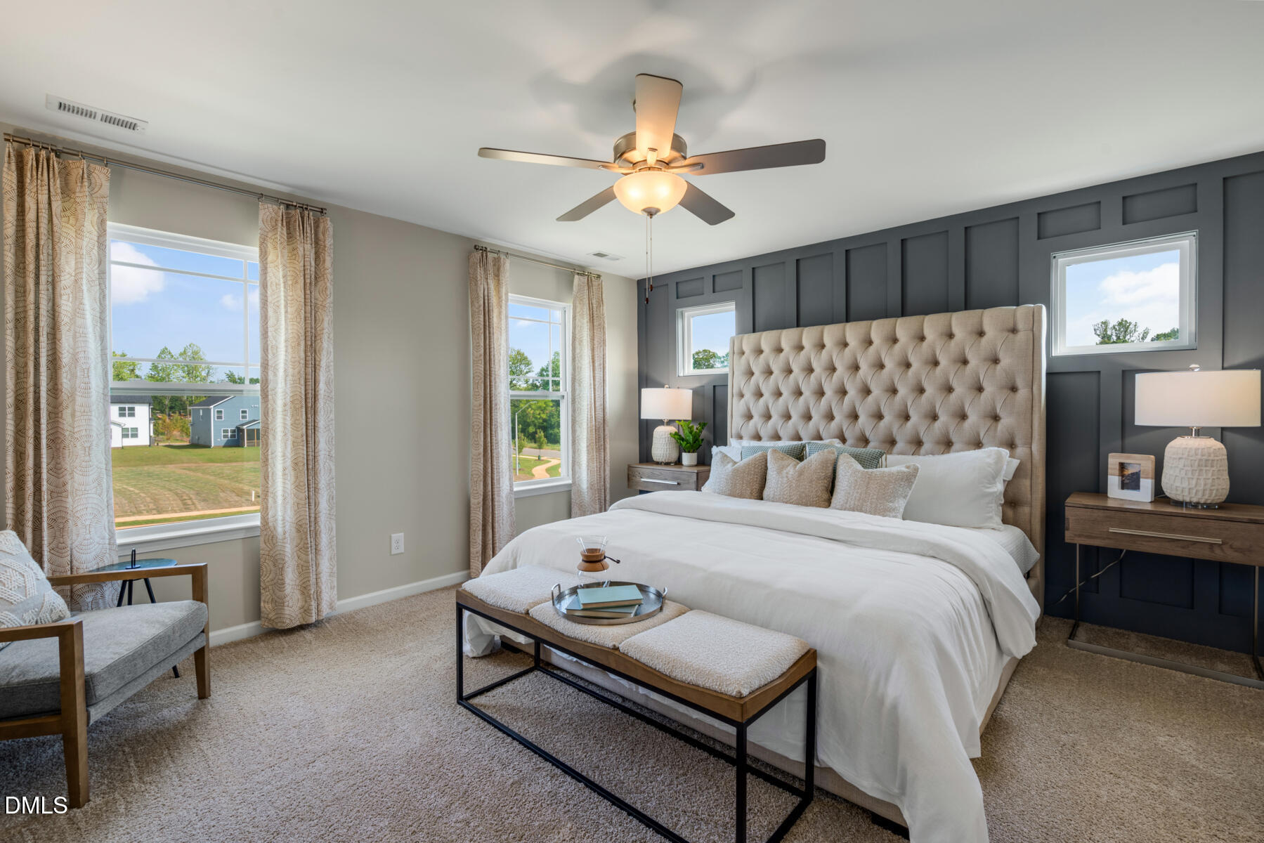 167 Siebold Street Garner, NC 27529 - Photo 41 of 46 a bedroom with a bed and a chandelier