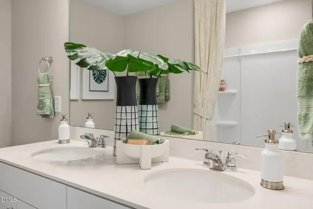 a bathroom with a sink a vanity and a mirror