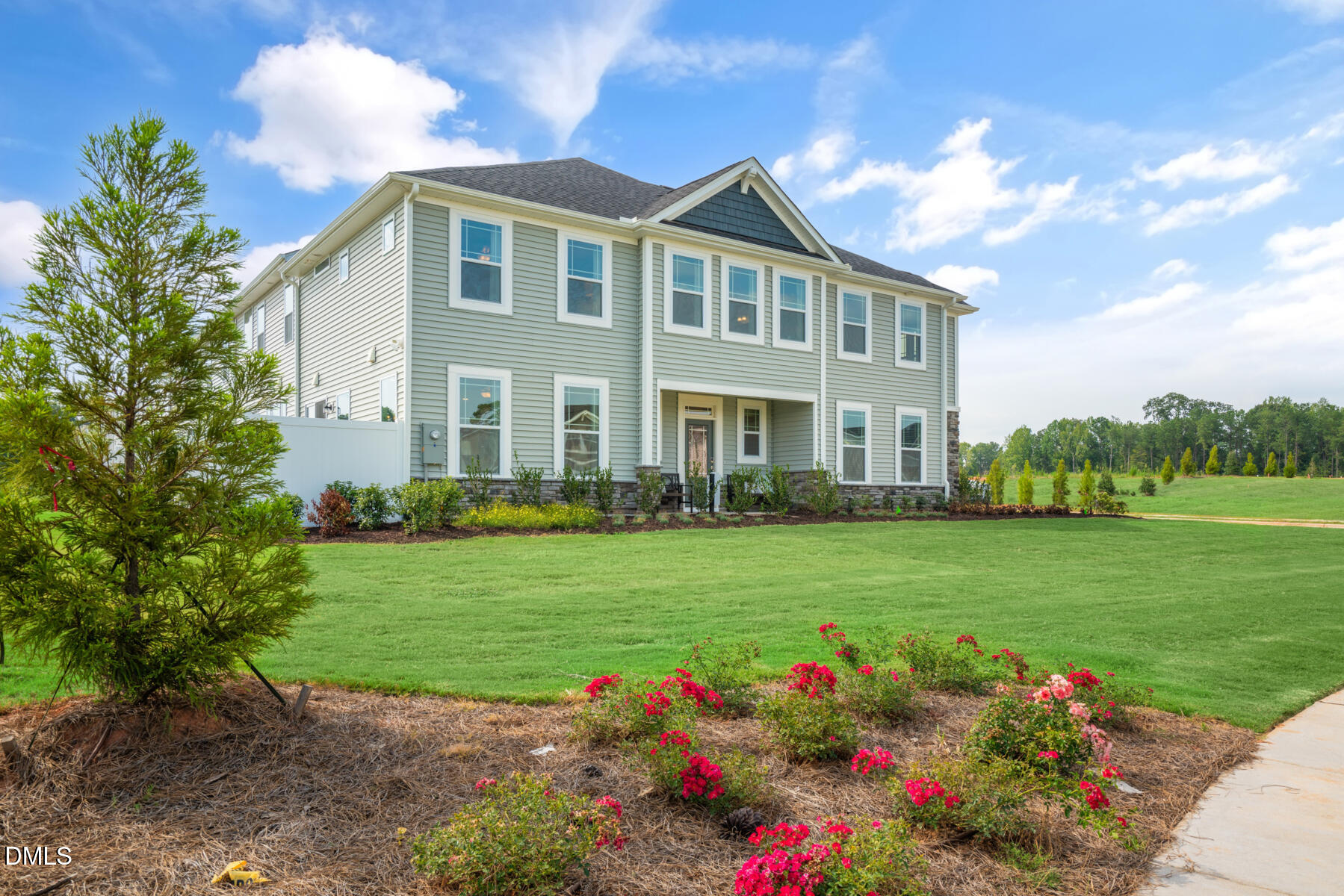 167 Siebold Street Garner, NC 27529 - Photo 10 of 42 a front view of a house with a big yard and potted plants
