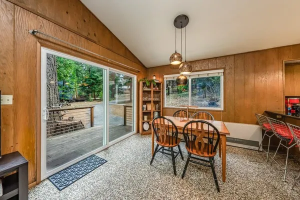 a view of a dining room with furniture window and outside view