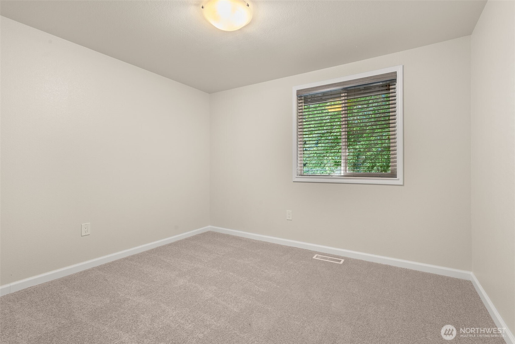 13603 Southeast 239th Street Kent, WA 98042 - Photo 15 of 23 an empty room with a window