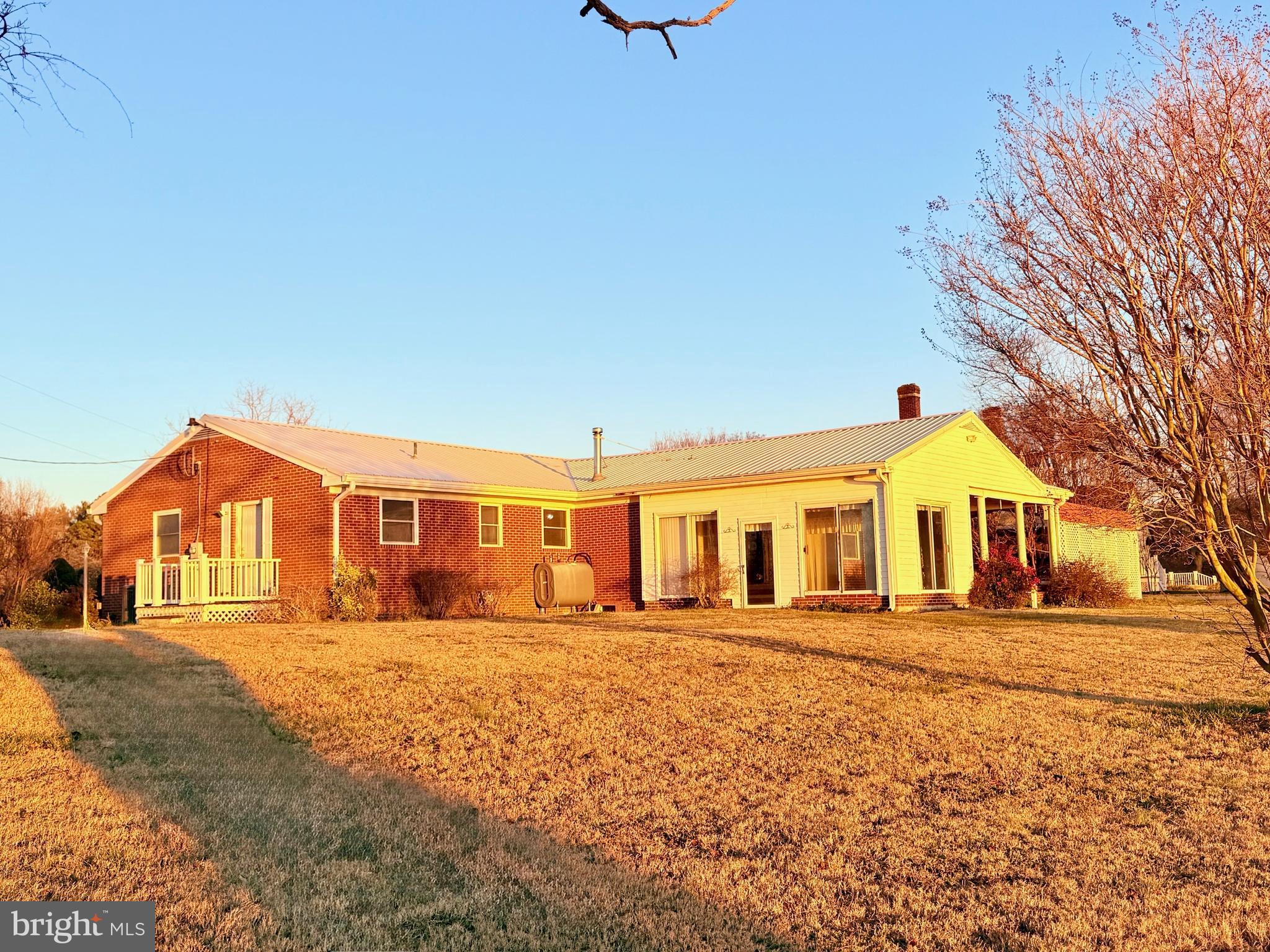 48724 Curleys Road Ridge, MD 20680 - Photo 11 of 44 a front view of a house with a yard