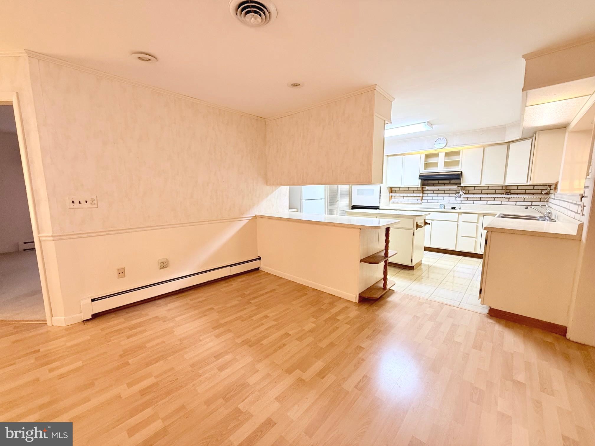 48724 Curleys Road Ridge, MD 20680 - Photo 18 of 44 a view of kitchen with wooden floor