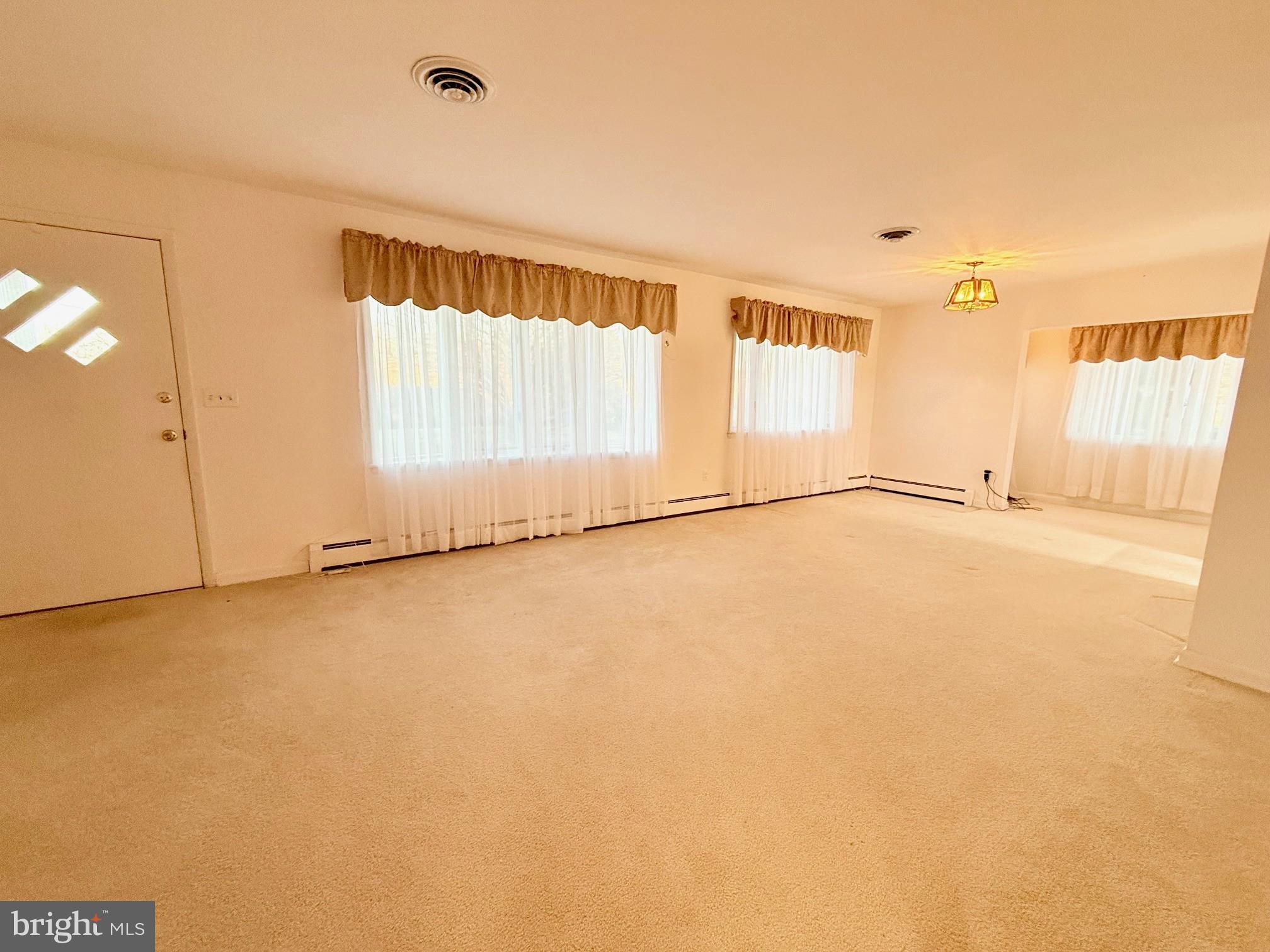 48724 Curleys Road Ridge, MD 20680 - Photo 19 of 44 a view of an empty room with a window