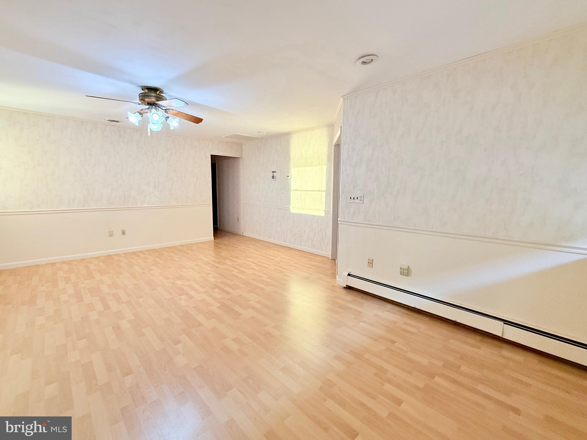 48724 Curleys Road Ridge, MD 20680 - Photo 21 of 44 an empty room with a ceiling fan and a window