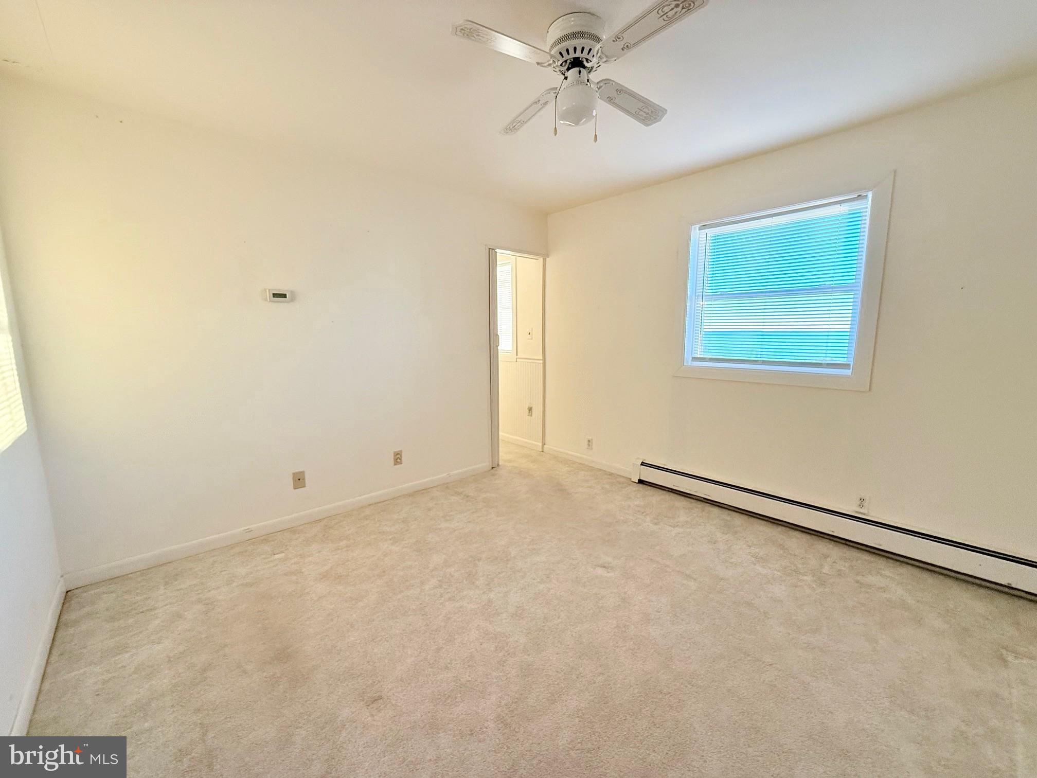 48724 Curleys Road Ridge, MD 20680 - Photo 26 of 44 a view of an empty room with a window