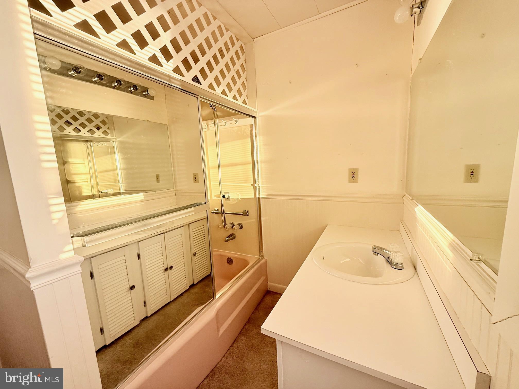 48724 Curleys Road Ridge, MD 20680 - Photo 27 of 44 a bathroom with a bathtub and a sink