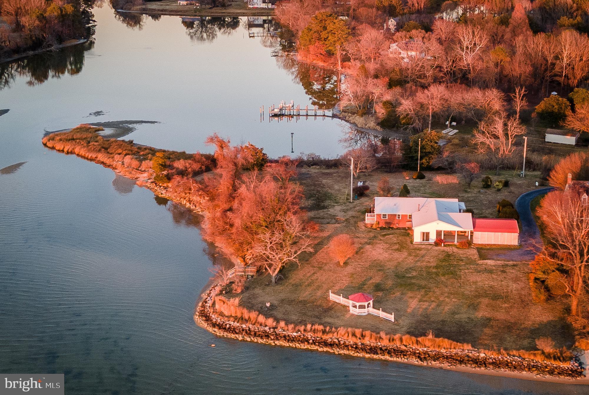 48724 Curleys Road Ridge, MD 20680 - Photo 4 of 44 an aerial view of a house with a yard swimming pool and outdoor seating