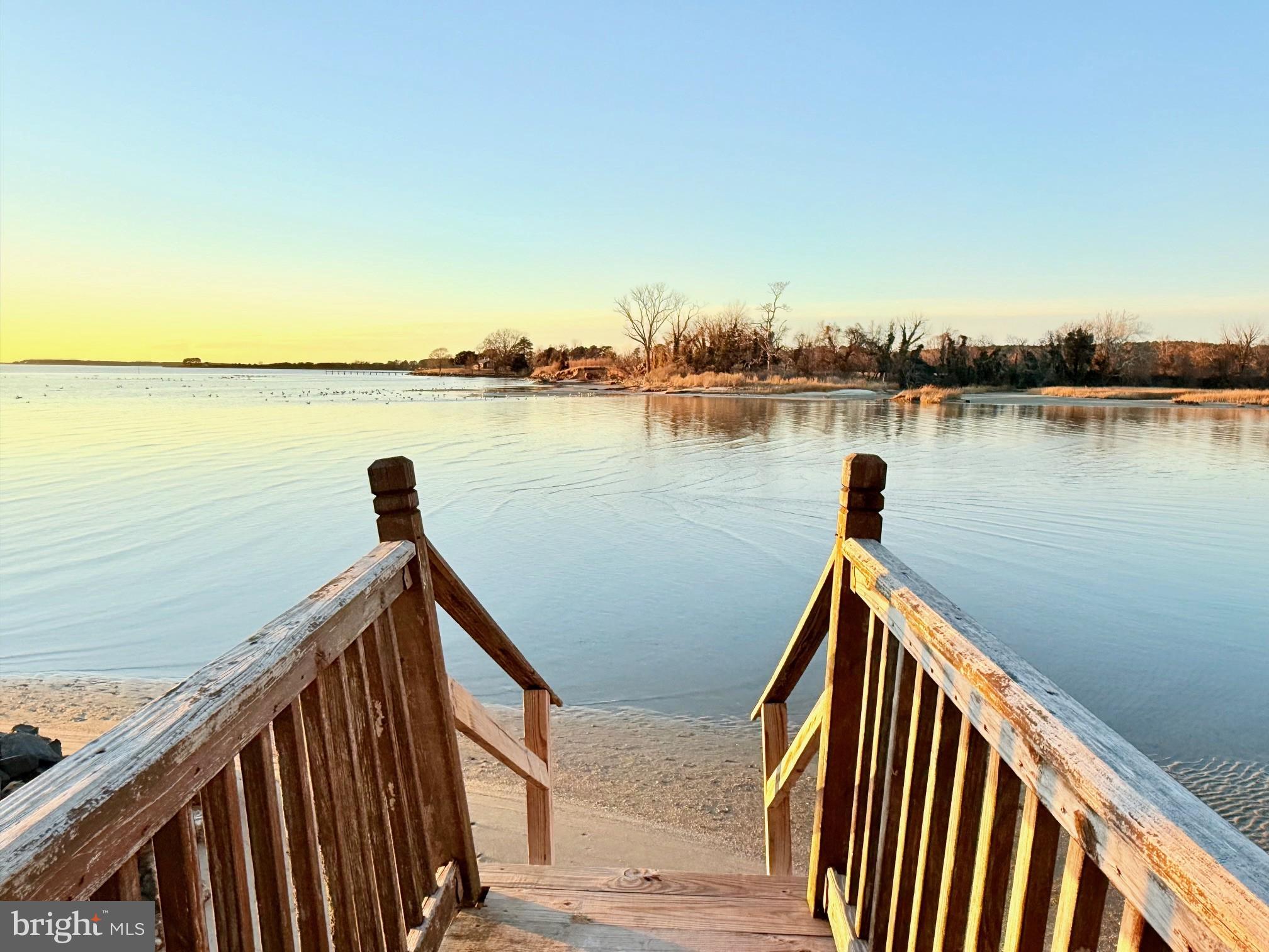 48724 Curleys Road Ridge, MD 20680 - Photo 9 of 44 a view of a balcony with wooden floor and lake view