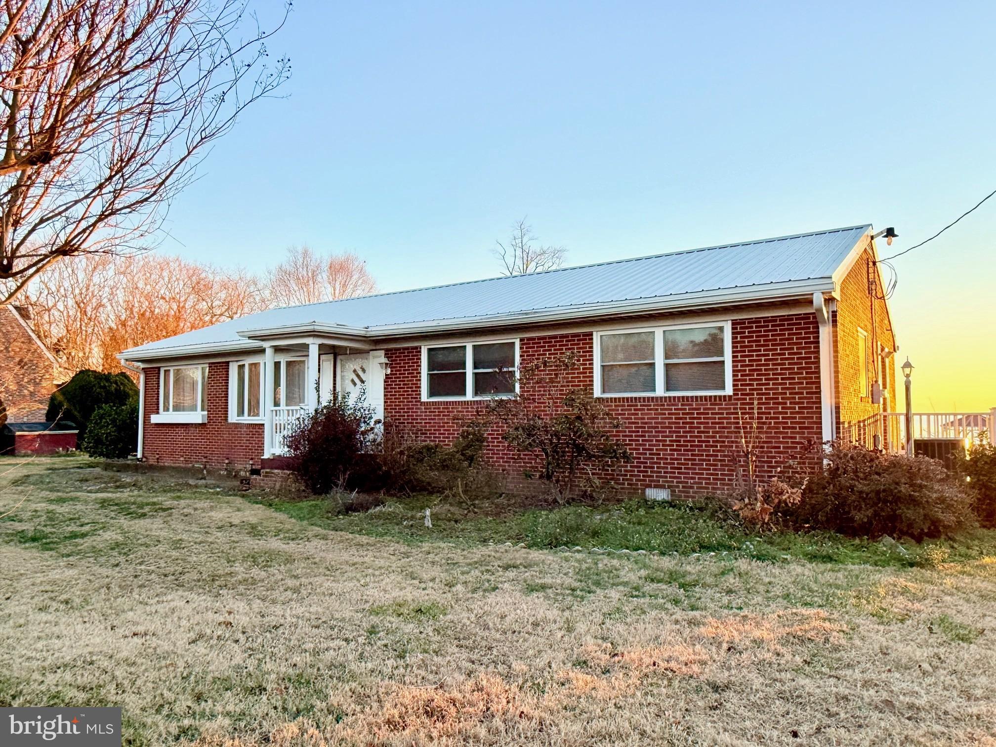 48724 Curleys Road Ridge, MD 20680 - Photo 10 of 44 a view of a house with yard and a garden