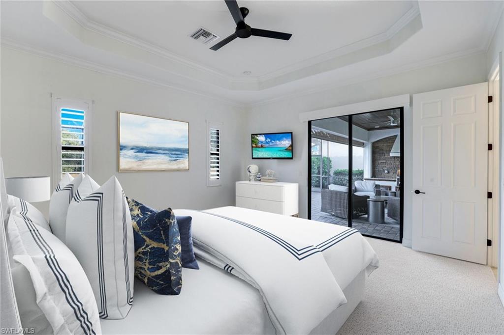 2806 Aviamar Circle Naples, FL 34114 - Photo 13 of 50 a bedroom with a bed and a large mirror