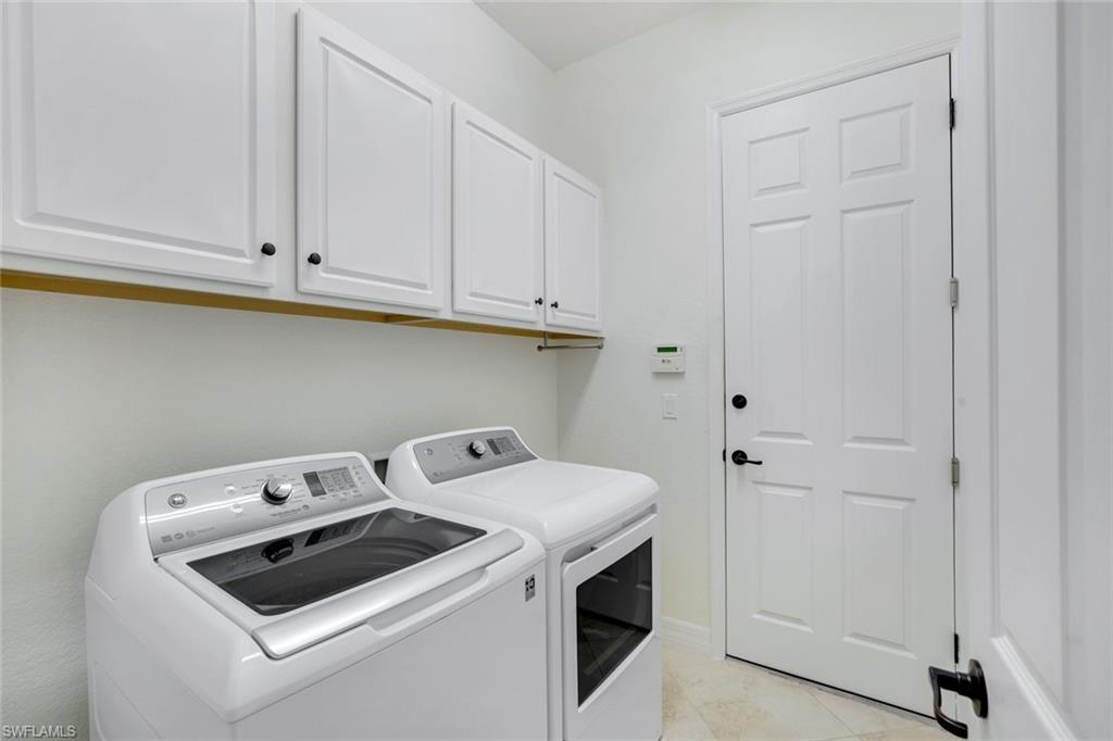 2806 Aviamar Circle Naples, FL 34114 - Photo 24 of 50 a utility room with dryer and washer