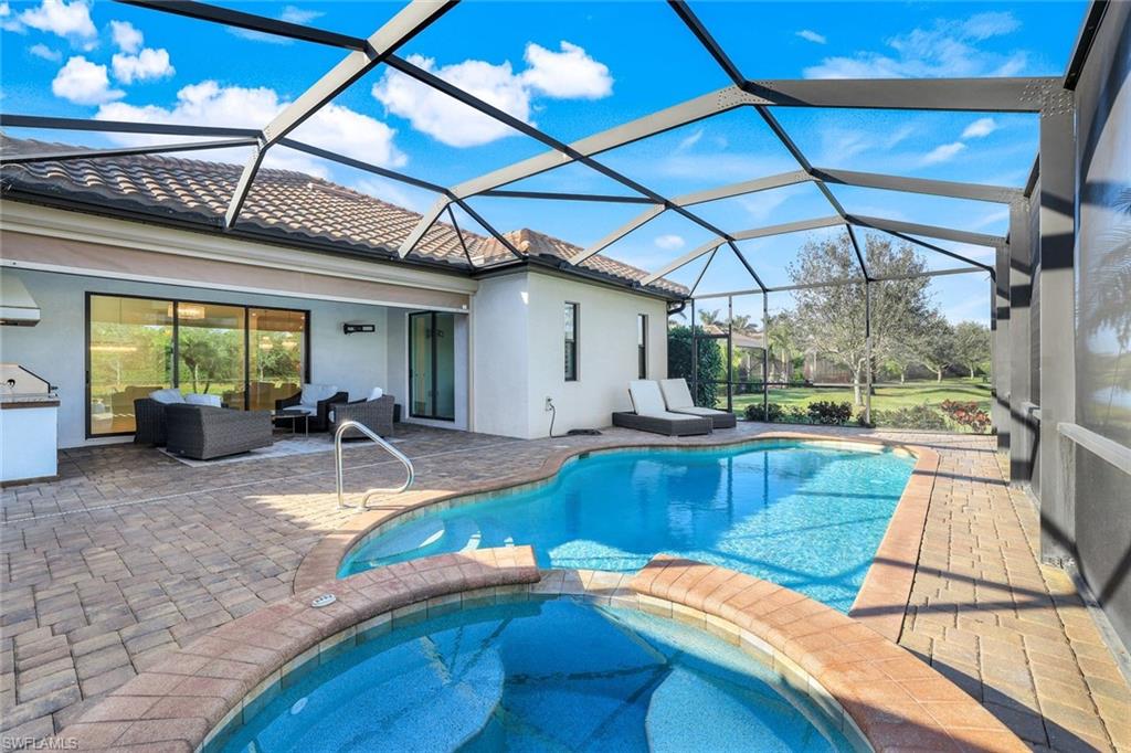 2806 Aviamar Circle Naples, FL 34114 - Photo 28 of 50 a view of a swimming pool with a patio