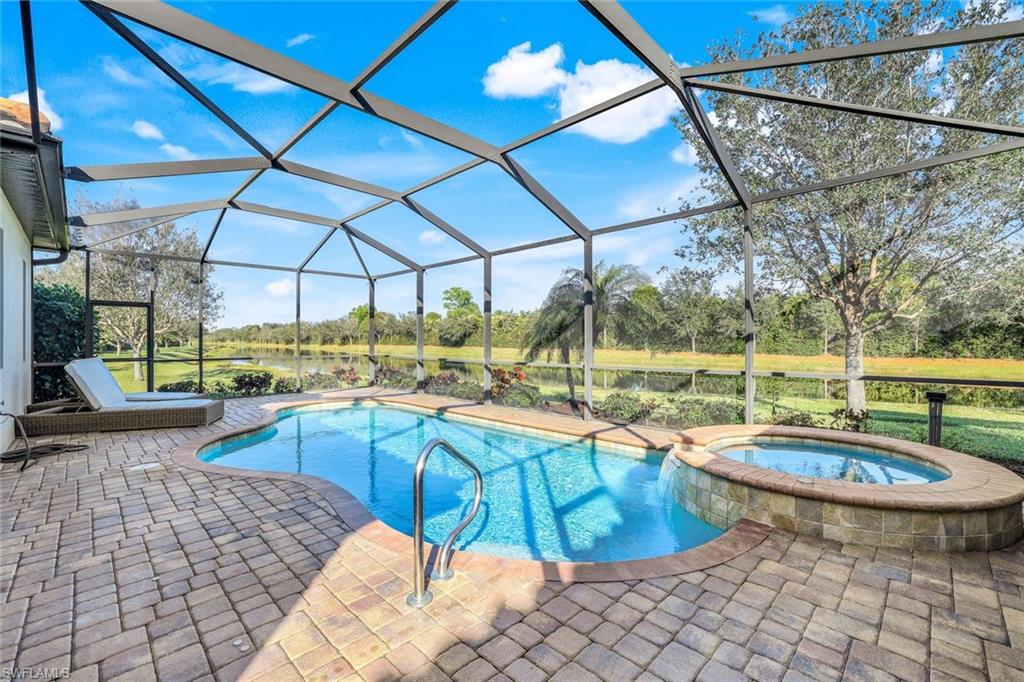 2806 Aviamar Circle Naples, FL 34114 - Photo 3 of 50 a view of a swimming pool with a patio
