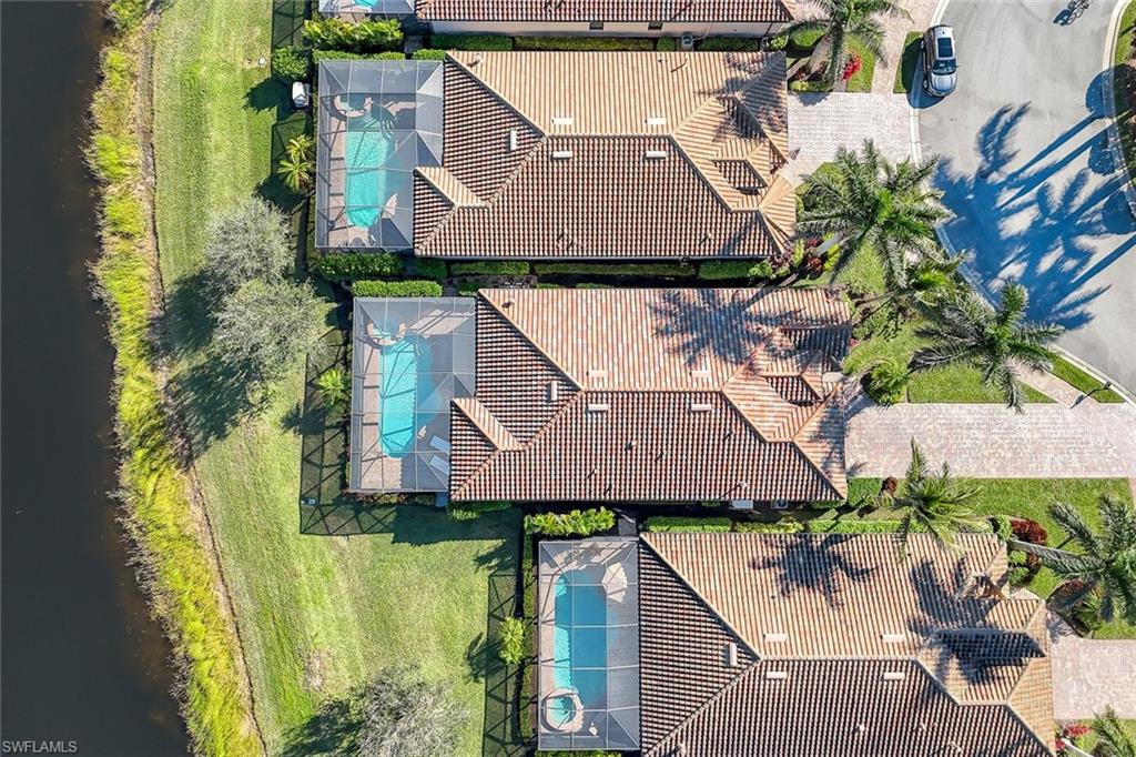 2806 Aviamar Circle Naples, FL 34114 - Photo 36 of 50 an aerial view of a house with a yard and potted plants