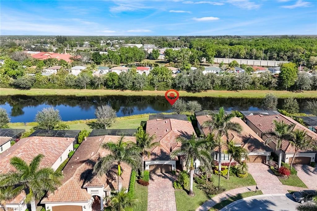 2806 Aviamar Circle Naples, FL 34114 - Photo 37 of 50 an aerial view of a city with lake view
