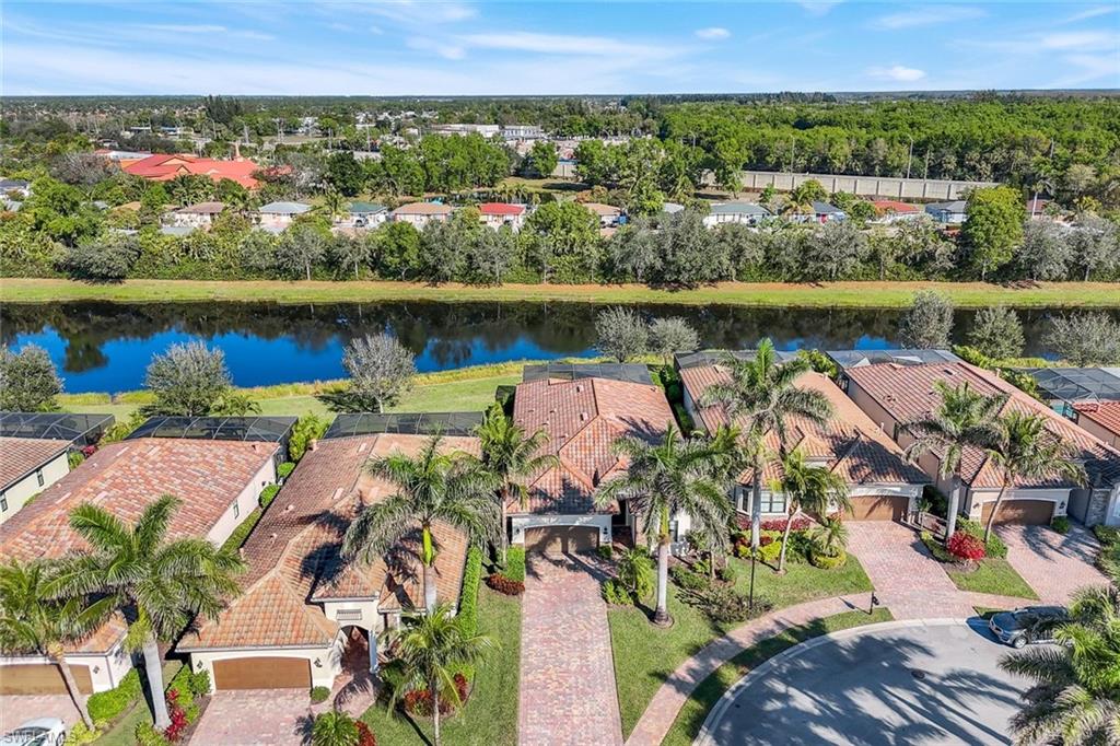 2806 Aviamar Circle Naples, FL 34114 - Photo 38 of 50 an aerial view of a residential houses with outdoor space and lake view