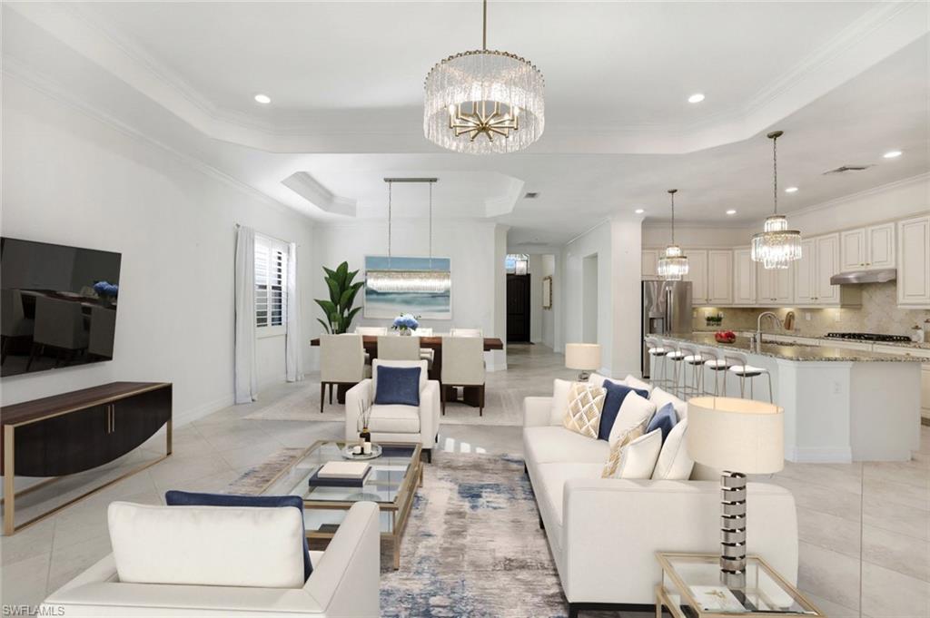 2806 Aviamar Circle Naples, FL 34114 - Photo 9 of 50 a living room with fireplace furniture and a flat screen tv