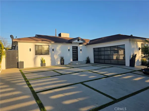 a front view of a house with a garage