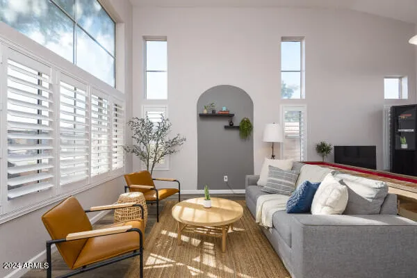 a room with furniture a flat screen tv and a window