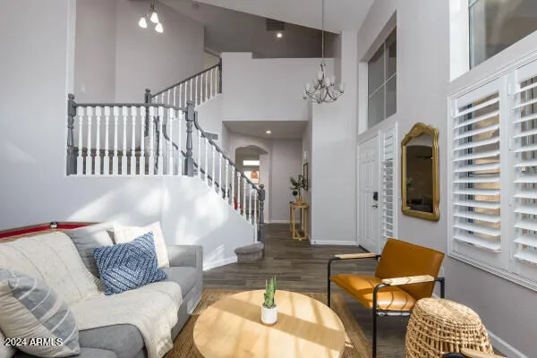 a kitchen with white cabinets and refrigerator
