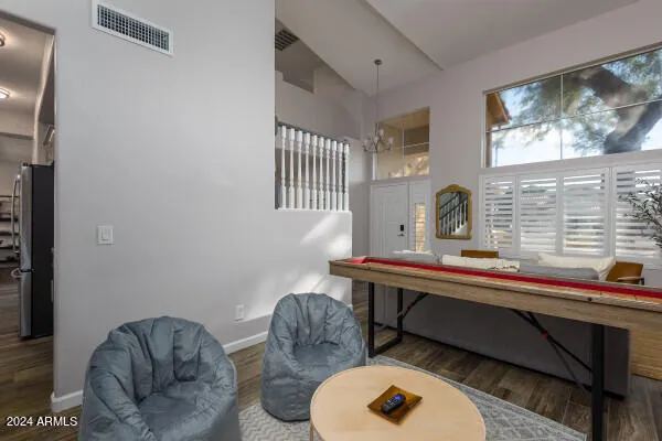 a view of a dining room with furniture and a window