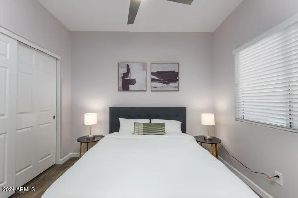 a bedroom with a bed and window