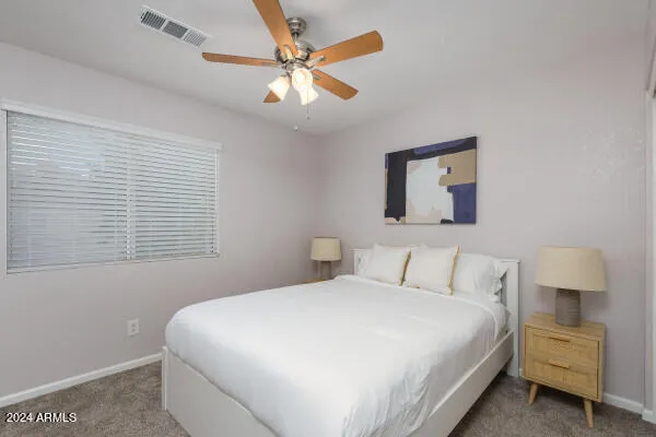 a view of a two chairs under an umbrella in patio