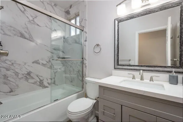 a view of a patio with a table and chairs under an umbrella
