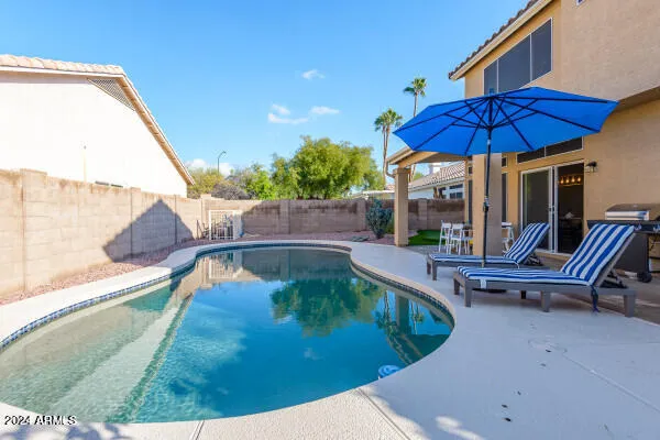 a view of storage and utility room with washer and dryer