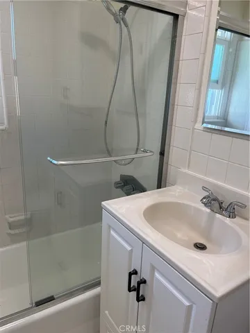a bathroom with a sink toilet and vanity