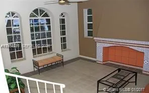 a view of front door with chair and door