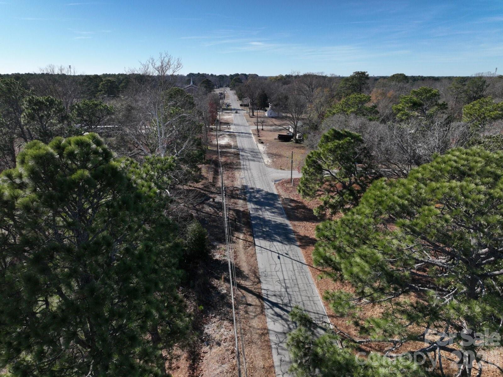0 Peejay Lane Fayetteville, NC 28303 - Photo 2 of 7 a view of a lush green forest with houses
