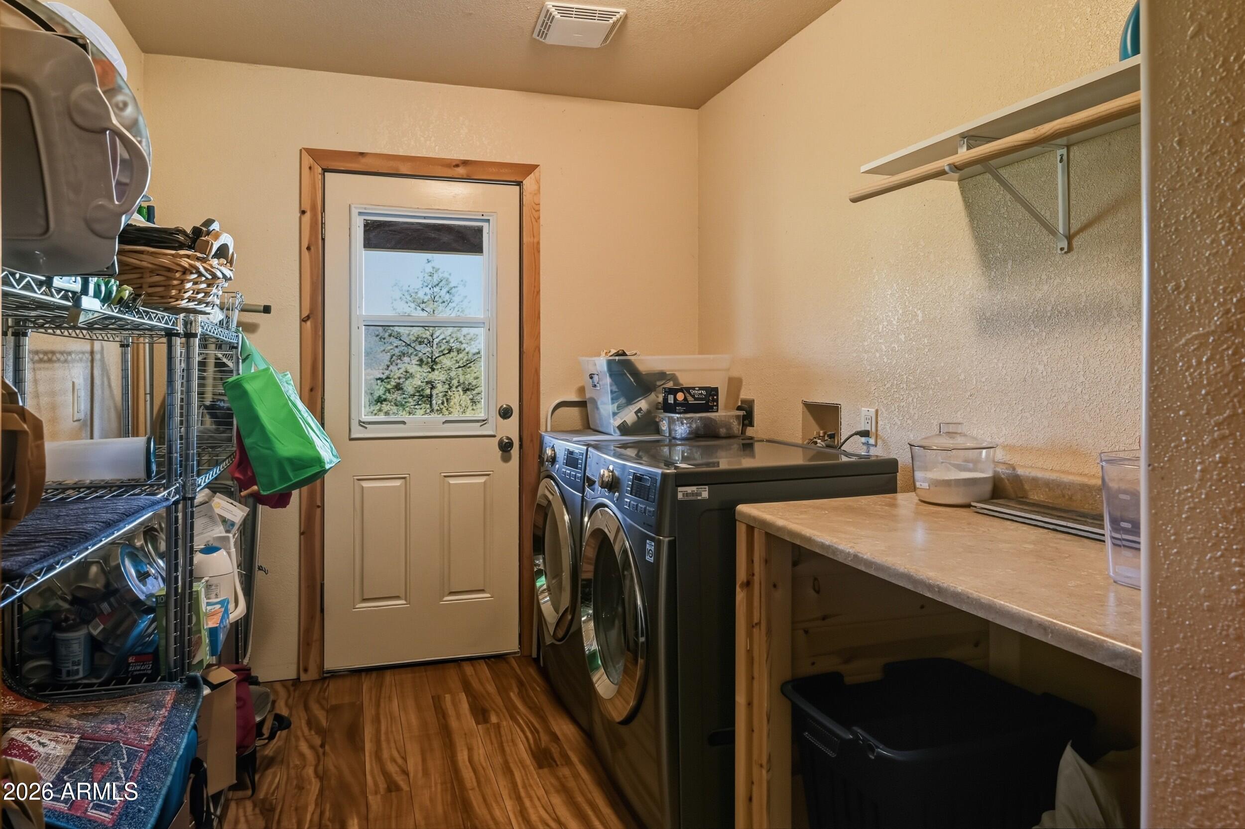 3119 Kysar Way Pine, AZ 85544 - Photo 26 of 68 a utility room with sink dryer and washer