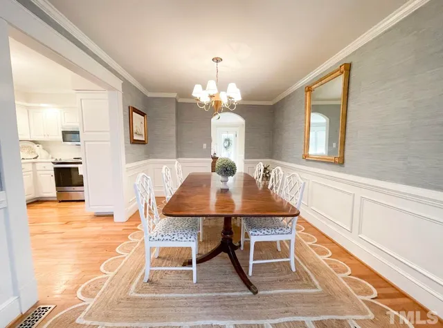 a kitchen with stainless steel appliances a stove microwave and sink