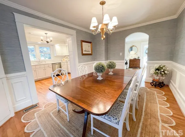 a kitchen with granite countertop a sink stainless steel appliances and cabinets