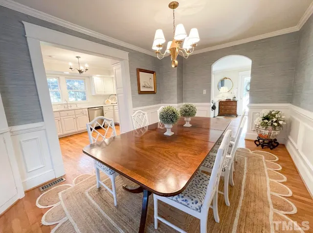 a kitchen with granite countertop a sink stainless steel appliances and cabinets