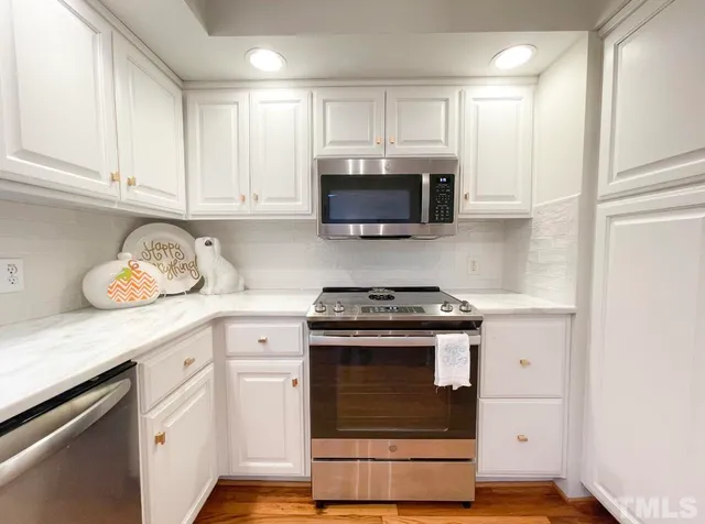 a bedroom with furniture and a large window