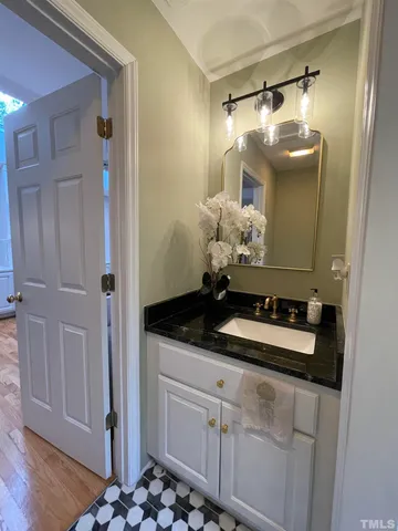 a bathroom with a sink a vanity and a mirror